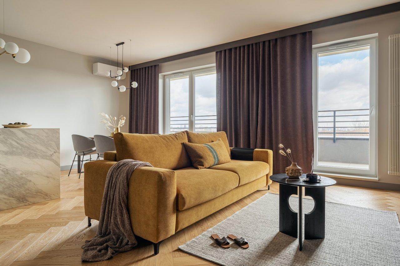 Appartement moderne meublé avec intérieur urbain, mobilier contemporain et ambiance chaleureuse.